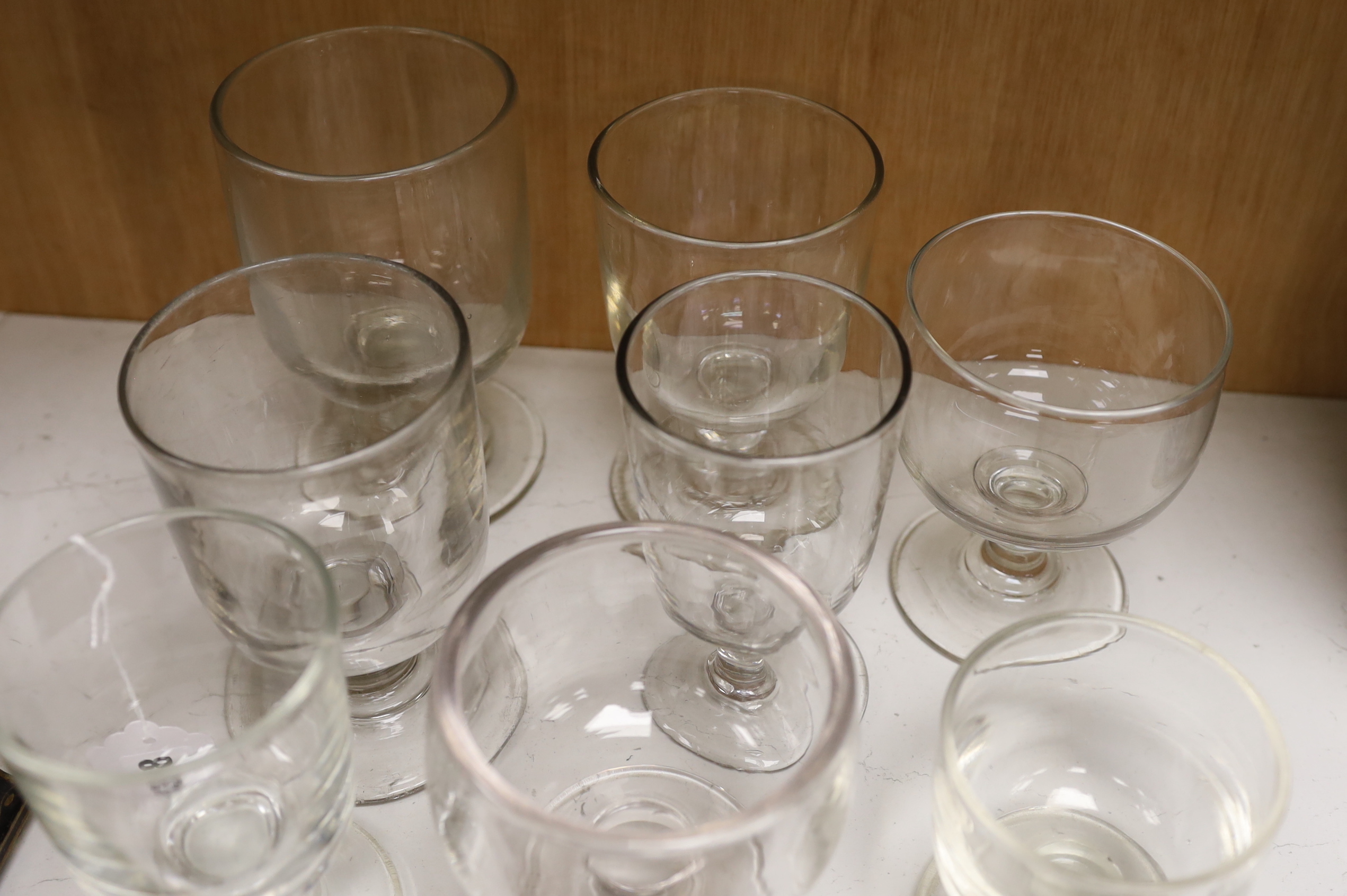 Eight varying sized glass rummers, tallest 15.5cm high